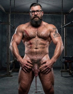 Hyperrealistic cinematic photograph, full body side and back view with perfect anatomy, zero distortions. Dark brutal dungeon gym with concrete floor, hanging chains, wooden stocks and BDSM equipment softly blurred in the background. Dramatic side lighting with strong contrast, deep shadows and visible sweat on both bodies.

Hipsterbarba stands in the center, 40 years old, 180cm, 80kg, 8% body fat, powerful muscle bear physique completely naked. Dense dark body hair covers his massive chest, shoulders, broad back and thick thighs. Long thick Bandholz beard, curled handlebar mustache, black glasses, standing straight with dominant posture.

Anil is right behind you, 25 years old, extreme bodybuilder slave, 175cm, 80kg, 6% body fat, completely smooth tanned skin from the neck down. Massive 127cm chest pressed firmly against your hairy back, eight-pack abs, 47cm veiny arms working, tiny 60cm waist, wide V-taper back, round 90cm glutes and 70cm quads. The tattoo 