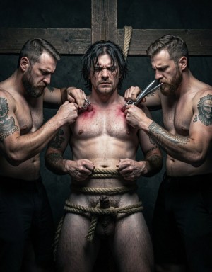 Un hombre gay de 30 años, con el torso desnudo y musculoso, está atado a una cruz de madera con cuerdas gruesas, en una habitación oscura y llena de sombras. Su cabello es oscuro y despeinado, y su mirada refleja un intenso dolor y sufrimiento. 

Dos hombres gays más, con barbas y tatuajes, están a cada lado del hombre atado, ambos con expresiones de intensa concentración y sadismo. Uno de ellos sostiene un objeto metálico afilado y brillante, mientras que el otro tiene un látigo de cuero en la mano.

El hombre atado tiene los pezones erectos y tensos, y ambos hombres los están torturando con instrumentos de tortura, uno con pinzas y el otro con un látigo, causando un dolor intenso y visible en el rostro del hombre. La escena es de un realismo extremo, con detalles precisos y una iluminación dramática que resalta el sufrimiento y el dolor del hombre atado.

La atmósfera es pesada y llena de tensión, con un ambiente de sadismo y dolor que se puede sentir en cada detalle de la escena. El estilo es hiperrealista, con texturas y sombras que hacen que la escena parezca casi palpable. El enfoque está en la tortura de los pezones y el sufrimiento del hombre, con un nivel de detalle que hace que la escena sea casi insoportable de ver.