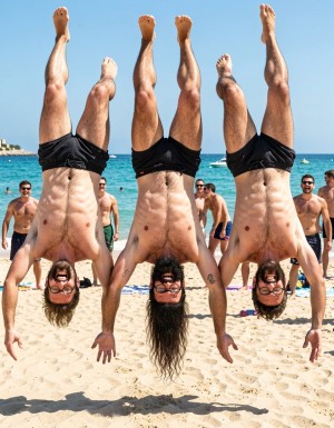 Hyperrealistic photograph captured at the exact peak of the flip in mid-air at midday on the sand of El Playazo, Vera Playa, Almería, right in front of chiringuito El Pirata. The three of you are completely naked and upside down in the middle of a full forward somersault, heads pointing straight down toward the sand, feet and legs pointing straight up to the sky, bodies perfectly inverted. Legs are spread wide open so your hairy assholes are completely exposed and centered in the frame for everyone to see, balls hanging downward by gravity, thick cocks also hanging and swinging toward your bellies.

Hipsterbarba is in the exact center: 40 years old, 1.80m, 80kg, 8% body fat, shredded dry six-pack now visible from below, dense black chest hair, trail running to your thick pubic bush, rounded pecs, wide shoulders, vascular arms, extremely long Bandholz beard hanging straight down toward the ground because of the inversion, spiral-curled mustache tips, black-rimmed glasses still on your face, high fade undercut hair, small “hipsterbarba” tattoo on your right biceps. Your hairy asshole is wide open and perfectly visible from this upside-down angle, pink ring fully exposed, heavy hairy balls dangling low, thick beautiful 19cm cock hanging down and pointing toward your chest.

To your left, Erik (38, strong hairy build, thick black beard hanging down) is also upside down with legs spread, hairy asshole exposed, thick 19cm cock and balls hanging by gravity. To your right, Ferran (36, athletic and hairy, shorter brown beard hanging down) flips in the same position, hairy asshole on full display, 17cm cock hanging freely.

All three of you have genuine laughs of pure joy on your inverted faces. Bright midday sun creates sharp highlights on every muscle, every drop of sweat flying off your bodies, and every single hair. The turquoise sea and the terrace of El Pirata are visible in the background with other naked men looking up at you, laughing and getting hard. Ultra-detailed skin texture, individual beard hairs hanging, perfect anatomical accuracy, cinematic lighting, pure joyful exhibition while fully inverted.