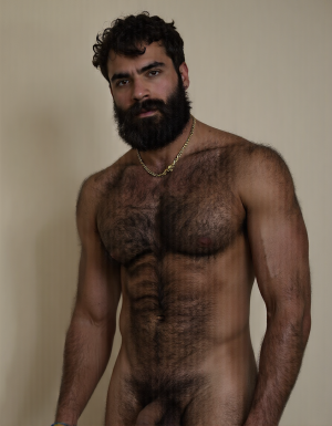 PEDRO es un hombre muy macho, delgado pero con músculos muy marcados y definidos,  está de pie. Tiene su polla erecta,

PEDRO tiene una cara geométrica masculina brutal, tiene la estructura ósea de un tío mediterráneo: pómulos altos que marcan sombras naturales bajo los ojos, tiene mandíbula cuadrada que se extiende hasta las líneas angulares perfectas antes de llegar a la barbilla, tiene la barbilla prominente con un amplio hoyuelo central firme y sobresaliente, es una cara sonriente pero impone respeto.

PEDRO tiene ojos oscuros, de color marrón profundo oscuro y están ligeramente hundidos bajo un arco supraciliar marcado que da una imagen de depredador peligroso, tiene cejas gruesas, densas y oscuras, casi rectas con una ligera curva natural, tiene los párpados entornados, tiene mirada de estar evaluando constante todo lo que le rodea, tiene las pestañas espesas y largas y negras.

PEDRO tiene nariz proporcionada a la cara, con el puente recto en forma clásica griega con la punta ligeramente redondeada y las aletas nasales expandidas, es una nariz que da carácter, que completa cara de gladiador retirado.

PEDRO tiene orejas de tamaño medio, pegadas al cráneo, casi ocultas por el pelo rizado que le cae a los lados, los lóbulos de las orejas son carnosos, las orejas de Pedro son perfectas y funcionales, proporcionadas al tamaño de su cabeza.

PEDRO tiene bigote que es un mostacho denso, espeso, de pelo negro azabache que le cubre todo el labio superior con una generosidad obscena, el bigote es abundante desde la base, con los pelos apretados unos contra otros formando una masa compacta que se extiende más allá de las comisuras de los labios y cae ligeramente hacia abajo en los extremos de la boca “estilo morsa”, el bigote tiene un acabado salvaje. Pedro no tiene barba y está afeitado y barbilla limpia.

PEDRO tiene pelo negro intenso, rizado, con volumen considerable, el pelo cae en ondas gruesas y desordenadas hacia los lados y hacia atrás, con textura natural de pelo denso y rebelde, el pelo de Pedro tiene brillo aceitoso de pelo sano, el pelo es recto y bajo, lo que le da una imagen de frente proporcionada pero no demasiado amplia, tiene pelo de tío macho.

PEDRO tiene cuello cuyos músculos esternocleidomastoideos están marcados y tensos a cada lado en forma de ve invertida que conecta la mandíbula con las clavículas, es un cuello corto en proporción y musculado, el cuello de Pedro tiene nuez pronunciada y es prominente y se ve bajo la piel bronceada, el cuello de Pedro tiene algunas venas finas que le recorren los laterales, en la base del cuello justo donde empieza el pecho tiene vello corporal asomando tímidamente, son unos pelos oscuros y dispersos.

PEDRO tiene pecho con una puta selva de vello, el pecho de Pedro es expansivo con las clavículas marcadas y separadas creando una plataforma horizontal sobre la que se asientan los pectorales, el pecho de Pedro tiene la piel de un color con tono aceitunado oscuro, bronceada de manera natural y uniforme, con brillo cálido, el pecho de Pedro tiene vello denso de pelo negro y rizado que le cubre desde la parte superior de los pectorales hasta el abdomen sin interrupción, el vello del pecho de Pedro es pelo grueso de color oscuro.

PEDRO tiene pectorales de músculos carnosos, que se separan en el centro creando un surco profundo donde la cadena dorada descansa, son pectorales de volumen generoso, están cortados con definición extrema de gimnasio y además tienen forma llena y potente de músculo funcional cubierto por una capa justa de carne que les da aspecto macizo, la parte inferior de cada pectoral crea una sombra curva sobre las costillas, marcando bien dónde termina el músculo, los pectorales de Pedro son sólidos y densos.

PEDRO tiene pezones visibles bajo el vello, son oscuros, de color marrón rojizo que contrasta con la piel aceitunada, de tamaño XL y ligeramente orientados hacia abajo y hacia los lados por la forma de los pectorales, los pezones de Pedro tienen areolas de tres centímetros de diámetro, con textura granulada típica, y el pezón central es muy protuberante endurecido y se marca a través del pelo, pelo oscuro y rizado van directamente desde las areolas, integrándolos completamente en el vello pectoral.

PEDRO tiene abdominales six-pack muy marcados, Pedro tiene un abdomen plano y firme con la musculatura subyacente visible pero cubierta por la capa de vello que baja desde el pecho sin interrupción, estrechándose a la altura del ombligo para formar un camino estrecho de pelo denso, el trail, que se convierte en una línea oscura y definida que desciende verticalmente como una flecha señalando hacia la entrepierna, tiene ombligo profundo y sobresaliente y es ovalado, rodeado de pelo, los abdominales de Pedro tienen los oblicuos laterales muy definidos y crean líneas diagonales a los lados de la cintura que enmarcan el abdomen, la musculatura de Pedro se aprecia bajo el vello de forma visible y es funcional de tío que hace muchos esfuerzos con su cuerpo.

PEDRO tiene brazos musculosos marcados, definidos y proporcionados al torso, los brazos tienen deltoides redondos y prominentes, con las tres cabezas del músculo visibles, creando una forma de bola en el hombro que separa el brazo del torso, los brazos de Pedro tiene bíceps marcados, tiene vena cefálica que le recorre la parte anterior del brazo bajo la piel, los brazos de Pedro tienen tríceps con forma de herradura en la parte posterior que dan volumen al brazo visto de perfil, los antebrazos son musculosos marcados y definidos y tienen la musculatura fibrosa y detallada, llenos de tendones visibles, los brazos de Pedro tienen vello abundante oscuro de pelo negro y rizado cubriendo especialmente los antebrazos donde forma una capa densa y uniforme que atrapa la luz del sol y le da aspecto primitivo, animal, la parte superior del brazo también tiene vello disperso pero presente, oscureciendo la piel bronceada.

PEDRO tiene manos con dedos y nudillos prominentes, son manos de trabajador, con la piel algo más áspera que el resto del cuerpo, tiene uñas cortas y cuadradas, las manos de Pedro tienen pelo oscuro en el dorso de las manos y en las primeras falanges de los dedos, disperso pero visible, las manos de Pedro tiene unas palmas perfectas y las líneas están marcadas profundamente, son manos que agarran bien.

PEDRO tiene piernas con los cuádriceps voluminosos y densos, con forma de lágrima invertida en la parte interna que delata músculo de verdad, y la separación entre el vasto externo y el recto femoral se marca flexionado, las piernas de Pedro tienen muslos marcados y definidos, cubiertos completamente por una capa generosa de vello negro rizado, denso, oscuro sobre la piel morena, la parte posterior de los muslos tiene los isquiotibiales definidos y tensos, con cuerdas musculares que se marcan, las piernas de Pedro tienen rodillas huesudas, funcionales y sus pantorrillas tienen gemelos duros con forma de diamante, cubiertos también de vello oscuro e indomable que le sube desde los tobillos hacia el muslo arriba. Pedro tiene piernas perfectas y muy masculinas .

PEDRO tiene pies proporcionados a la estructura de su cuerpo de macho, tiene los pies rectos con las uñas cortas y algo amarillentas por el sol y las sandalias, los pies de Pedro tienen planta callosa y se distinguen los talones perfectos y la base de los dedos es canosa, los pies de Pedro tienen pelo oscuro en el empeine y en los dedos, disperso pero visible, conectando con el vello de las pantorrillas, el arco del pie es pronunciado, y los tendones extensores se marcan en el empeine flexionando los dedos, los pies de Pedro tienen apariencia sólida.

PEDRO tiene una polla de treinta y cinco centímetros de longitud de carne de un tono ligeramente más oscuro que el resto de su piel de color marrón aceitunado el color marrón aceitunado de la polla de PEDRO se oscurece hacia el glande, la polla de Pedro tiene ocho centímetros de diámetro, la polla de Pedro es de carne  de volumen brutal con las venas dorsales azuladas marcadas bajo la piel, el tronco de la polla de Pedro es ligeramente curvado hacia arriba y está dura, y la piel está cubierta en la base de la polla por una maraña de vello púbico negro, espeso y rizado que conecta directamente con el trail que baja desde el ombligo, la polla de Pedro tiene el prepucio cubriendo parcialmente su glande, de cabeza roma y rojiza, con el meato uretral como una ranura vertical que gotea por excitación sexual, es una polla dura que apunta hacia arriba con curva amenazante y hace sombra sobre los huevos.

PEDRO tiene huevos que cuelgan mcho, tienen el escroto oscuro, arrugado, cubierto por vello rizado y disperso, los huevos de Pedro son dos esferas de cinco centímetros de diámetro cada uno y son perfectamente simétricos, que se balancean entre sus muslos como péndulos, el huevo izquierdo cuelga ligeramente más bajo que el derecho, la piel del escroto es más oscura que el resto del cuerpo con tono marrón profundo, el escroto está extendido dejando los huevos descolgar desde la base de la polla, son huevos que están llenos, que producen corridas espesas, abundantes y calientes.
PEDRO es un hombre muy delgado con rasgos mediterráneos, se le ve de cuerpo entero desde la coronilla de la cabeza hasta las plantas callosas de los pies, pasando por los treinta y cinco centímetros de polla. Fondo 🏞️. Imagen ultra alta definición 8K.