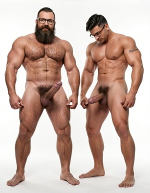 A highly detailed full-body photograph of both men standing completely naked in a bright white photography studio with perfect even lighting. On the left stands Hipsterbarba, the 40-year-old dominant muscle bear master: 180cm tall, 80kg with 8% body fat, powerful athletic physique, massive rounded pecs, defined six-pack, wide shoulders, thick vascular arms, powerful legs, wide V-shaped back, dense dark body hair covering chest, shoulders, abs, thick pubic bush and thighs. High fade undercut haircut, very thick long Bandholz beard reaching almost to his chest, thick curled handlebar mustache with spiral ends, black-rimmed glasses, small tattoo on right arm saying “hipsterbarba”. Thick cock with partial foreskin and visible pink glans, heavy low-hanging balls. He stands in a serious dominant pose, chest out, looking straight at the camera with authority, bare feet planted firmly.

On the right, slightly behind and in a submissive pose with head slightly bowed, stands Anil, the 25-year-old extreme bodybuilder slave: 175cm tall, 80kg with 6% body fat in peak competition condition, massive 127cm chest with huge thick pecs, 47cm vascular peaked arms, deep shredded eight-pack, tiny 60cm waist with extreme V-taper, wide flaring lats, high round bubbly 90cm glutes, 70cm massive shredded quads with razor sharp separation. Skin bronzed, paper-thin and shiny, completely smooth and hairless from the neck down. Thick veiny cock and large smooth shaved balls. Small black tattoo on right bicep clearly reading “Hipsterbarba mi amo”. Masculine face looking down submissively.

Both men fully naked head to toe, realistic skin texture, extreme muscle and hair details, professional studio photography.