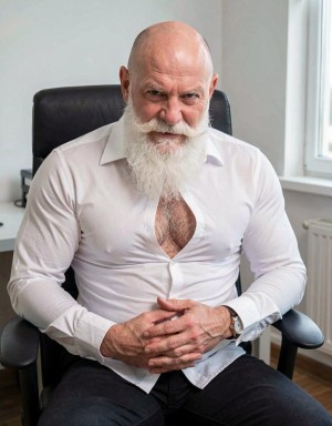 Mature bald man sitting in a black office chair, with a long, thick white beard and a prominent mustache that give him a serious and dominant appearance. He wears a fitted white shirt, partially unbuttoned at the chest, revealing body hair, and dark pants. His hands are clasped on his lap, with a watch on his wrist, while he looks directly at the camera with an intense and confident expression. The setting appears to be a bright, sober office, with a light-colored wall, side window, radiator, and wooden floor, creating an elegant, firm, and professional masculine portrait scene.