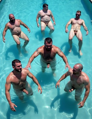 Wide shot of multiple massive shredded muscular bearded military men swimming backstroke breaststroke in pool completely naked showing erect cocks and balls floating on water surface, lead soldier with thick black beard sharp military high and tight flat top haircut short on sides very short hair on top brushed straight up flat getting wet, all swimming on backs face up with insanely muscular physiques visible, massive hairy pectorals cobblestone abs thick muscular arms and legs doing breaststroke motion, large fully erect thick veiny cocks standing up out of water and huge heavy hairy balls floating on water surface clearly visible, all soldiers swimming synchronized backstroke with happy relaxed expressions, group of five to six naked ultra-muscular bearded soldiers spread across bright blue pool water all face up showing erections, arms pulling through water in breaststroke motion legs kicking, ripples and gentle waves on pool surface, outdoor swimming pool, bright sunny daylight, photorealistic extreme detail of naked massively muscular soldiers swimming backstroke with erect cocks and floating balls visible above water