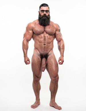 A highly detailed full-body nude photograph of Hipsterbarba, a 40-year-old muscle bear master, standing completely naked from head to toe in a bright white photography studio with perfect even lighting. He is exactly 180cm tall, 80kg with 8% body fat, strong and athletic physique. Massive rounded pecs, very defined six-pack abs, wide shoulders, thick vascular arms, powerful legs, wide V-shaped back. Dense dark body hair covering his chest, shoulders, abs, thick pubic bush and thighs. High fade undercut haircut, very thick long Bandholz beard that reaches almost to his chest, thick curled handlebar mustache with spiral ends, black-rimmed glasses. Small tattoo on his right arm that says “hipsterbarba”. Thick cock with partial foreskin and visible pink glans, heavy low-hanging balls. Serious dominant expression, bare feet on the floor, full body view from head to toes, ultra realistic skin texture, dense body hair details, professional studio photography.