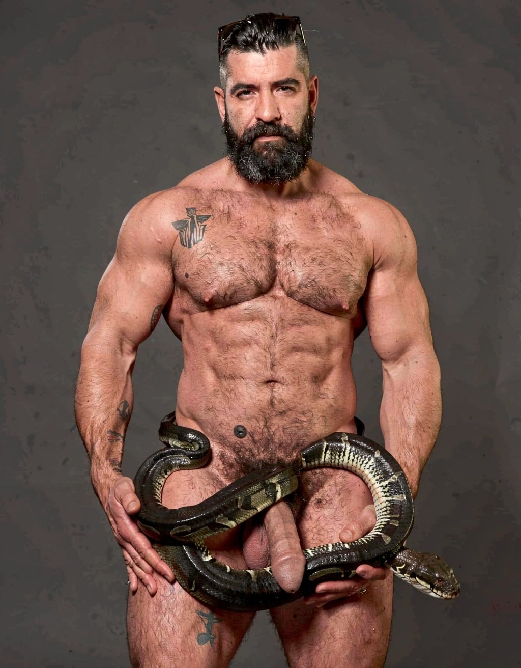 A powerful muscular Greek man named Dimitris, 40 years old, hairy chest and thick beard, athletic mature body covered in dark fur, stands naked in dim warm light. A large glossy python snake with black and emerald green scales is sensually and tightly coiling up his right leg in smooth spiraling loops, starting from the calf, gripping the thick hairy thigh with possessive pressure. The snake’s heavy muscular body then wraps tightly around his heavy hanging balls, lifting and squeezing them in several firm coils, before continuing upward to spiral around his thick veiny erect cock from the base all the way to the swollen head, constricting it with slow rhythmic contractions. The snake’s scales contrast against his tanned skin and dark pubic hair, dramatic side lighting creating strong highlights on the glossy scales and sweaty skin, intense erotic tension, highly detailed, cinematic atmosphere.