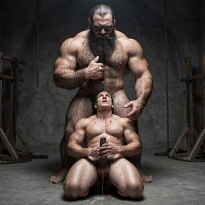 Hyperrealistic cinematic photograph inside the dark brutal dungeon gym. Dramatic low-angle full body shot from slightly below, capturing the exact moment. 

Hipsterbarba, the 40-year-old dominant muscle bear master, stands tall and powerful in the center, completely naked, 180cm, 80kg, 8% body fat, thick hairy chest and abs covered in dense dark fur, long thick Bandholz beard reaching almost to his pecs, curled handlebar mustache, black glasses, arms relaxed but imposing. His expression is cold, arrogant and dominant as he looks down at his slave. His thick cock hangs heavy between his muscular hairy legs.

Directly in front of him, on his knees on the cold concrete floor, is Anil, the 25-year-old extreme bodybuilder slave, 175cm, 80kg, 6% body fat. His massive 127cm chest is pushed forward, eight-pack clearly defined with red whip marks still visible, tiny waist, huge round glutes resting on his heels, 70cm quads flexed. Completely smooth tanned skin shining with sweat. The metal cock ring is still tight around the base of his swollen, throbbing cock, dripping a long string of precum onto the floor. Fresh cum still leaks slowly from his used hole down the inside of his thighs.

Anil is looking straight up into Hipsterbarba’s eyes with pure, terrified love in his gaze. His dark eyes are wide, glassy, full of fear and desperate adoration. His mouth is slightly open, breathing fast. Both of his big veiny hands are desperately holding Hipsterbarba’s right hand, clutching it tightly against his own chest as if it were his only anchor. His whole body is visibly trembling with fear and emotion.

Sharp dramatic lighting from above creates strong shadows that accentuate every muscle, vein and the power imbalance between the standing dominant and the kneeling slave. Chains, wooden stocks and BDSM equipment visible in the dark blurred background. Intense, raw and emotional atmosphere of total submission and unspoken love. Extreme detail, photorealistic, frozen in time.