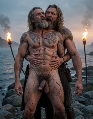 Amleth y Aurvandil. Dos vikingos de cuerpo entero, plano general, fiordo nórdico al anochecer, niebla baja densa y bruma natural, antorchas de fuego real con chispas y humo ondulante, contraluz crepuscular profundo con degradado de azul cobalto a naranja quemado, iluminación cinematográfica de tres puntos con relleno lateral cálido y clave alta, estilo visual de Robert Eggers (The Northman), fotografía analógica emulando película Kodak Vision3 500T 35mm con grano natural, hiperrealismo extremo nivel macro, calidad 8K nativa sin compresión, textura de piel con poros visibles, imperfecciones, pelos individuales, suciedad incrustada y sangre seca con textura costrosa, contraste HDR dinámico, sombras negras profundas sin pérdida de detalle, altas luces controladas sin quemado, lente anamórfica 40mm con aberración cromática mínima, profundidad de campo ultra reducida, ratio de aspecto 9:16 vertical, composición simétrica perfecta, saturación natural con tonos fríos y cálidos equilibrados, sin ruido digital, sin artefactos, sin compresión JPEG.

Amleth (Alexander Skarsgård), 29 años, 194 cm, 7% grasa corporal, cuerpo esculpido al detalle máximo, musculatura hipertrofiada y funcional, pectorales anchos con separación visible, abdominales six-pack con relieve profundo y definición quirúrgica, oblicuos marcados, cintura extremadamente estrecha acentuando la forma en V del torso, dorsal ancho desarrollado visible en la espalda, hombros desproporcionadamente anchos con deltoides redondeados, brazos en alto con bíceps en pico y tríceps en herradura, venas del antebrazo marcadas como cuerdas, antebrazos fibrosos, manos grandes y callosas, muslos poderosos con cuádriceps definidos, pantorrillas fibrosas, pies anchos con dedos sucios y uñas astilladas. Piel pálida grisácea con capas visibles de mugre, barro seco agrietado y sangre oscura incrustada en las líneas de la piel. Cicatriz grande y profunda que cruza el torso desde el hombro derecho hasta la cadera izquierda, cicatrizada en relieve, cortes menores en brazos y costillas. Tatuajes nórdicos oscuros y densos, líneas negras gruesas de símbolos rúnicos, nudos celtas y figuras geométricas cubriendo completamente el pecho, ambos hombros y la espalda visible. Vello corporal denso, oscuro y natural en pecho con concentración en el esternón y la línea alba, vello más fino en brazos y piernas. Pelo rubio sucio muy largo hasta los omóplatos, lacio, grasiento, con nudos y mechones más oscuros, parte del pelo pegado a la frente y las sienes por el sudor. Barba espesa, desigual y enmarañada, más larga en la barbilla, mezcla de rubio sucio y castaño claro con restos de comida y sangre seca. Cara angulosa, mandíbula cuadrada pronunciada, pómulos marcados, ojeras profundas. Ojos azul pálido casi grises con mirada fija, desquiciada, pupilas dilatadas, venas rojas visibles en el blanco del ojo. Labios finos, agrietados y partidos con costras de sangre. Cicatriz en el labio superior que deforma ligeramente la comisura hacia arriba. Pene erecto de 22 cm de largo, 4 cm de ancho, circuncidado, glande bulboso grande de color rosa-rojizo oscuro o violáceo, corona del glande marcada y sobresaliente, uretra visible con abertura ancha y húmeda, tronco del pene largo con venas gruesas y tortuosas recorriendo el lateral, frenillo carnoso tirante de color más claro, prepucio retraído mostrando el glande completamente expuesto, piel del tronco tirante y brillante por la erección. Vello púbico extremadamente denso, oscuro, rizado, en V invertida que sube formando una línea hasta el ombligo, mezclado con sudor. Testículos grandes, colgantes, muy asimétricos (el izquierdo más grande y más bajo), escroto arrugado, texturizado y más claro que el resto del cuerpo, con vello fino. Sandalias vikingas de cuero marrón oscuro atadas con tiras que suben hasta media pantorrilla, cuero gastado y manchado de barro.

Aurvandil (Ethan Hawke), 48 años, 190 cm, 8% grasa corporal, cuerpo musculado fibroso y envejecido de rey guerrero, piel más curtida y arrugada que Amleth, vello corporal muy abundante en pecho (espeso y canoso), brazos peludos, piernas con vello denso, aspecto masculino y brutal. Pene erecto visible, grueso, vello púbico canoso, testículos grandes. Pelo canoso largo y despeinado, barba larga descarnada y descuidada, arrugas profundas en el rostro, mirada chamánica y consumida por los años de guerra y poder.

Pose: Amleth de pie delante de Aurvandil. Aurvandil abraza a Amleth por detrás presionando su torso desnudo contra la espalda de Amleth, la piel del pecho peludo de Aurvandil aplastada contra los músculos dorsales del príncipe. Brazos de Aurvandil rodean con fuerza la cintura estrecha de Amleth, los antebrazos apoyados contra el abdomen marcado. Una mano de Aurvandil agarra firmemente el pene erecto de Amleth, los dedos rodeando el tronco, nudillos blancos por la fuerza. Aurvandil tiene la boca completamente abierta besando, mordiendo y lamiendo el cuello de Amleth, la lengua visible presionando la piel, la barba canosa hundida en el hombro y la nuca del joven, saliva brillante sobre la piel sucia. Amleth tiene la cabeza echada hacia atrás apoyada en el hombro de Aurvandil, garganta expuesta y vulnerable, brazos en alto con codos flexionados, manos abiertas, bíceps hinchados al máximo, ojos semi-cerrados con expresión de gruñido animal, boca entreabierta mostrando dientes, labio superior levantado por la cicatriz, músculos del cuello tensos, todo el cuerpo en tensión y entrega.